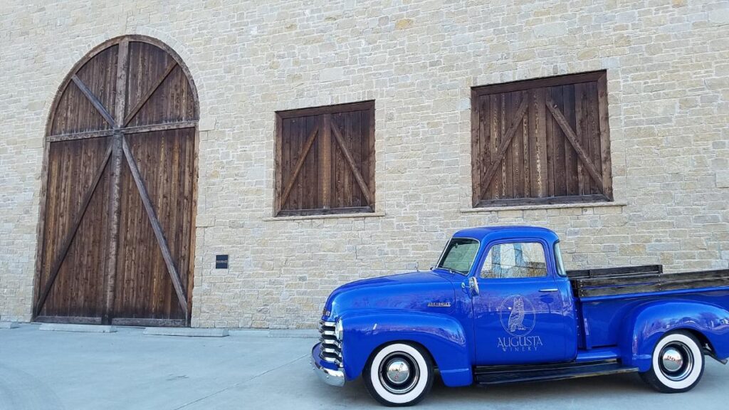 vintage blue truck parked next to the cellar house at Augusta Winery
